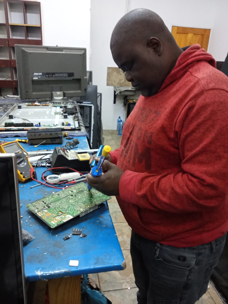 Technician repairing a home appliance